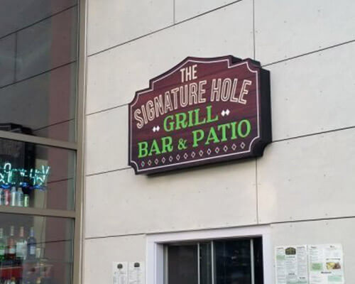 The Signature Hole building sign
